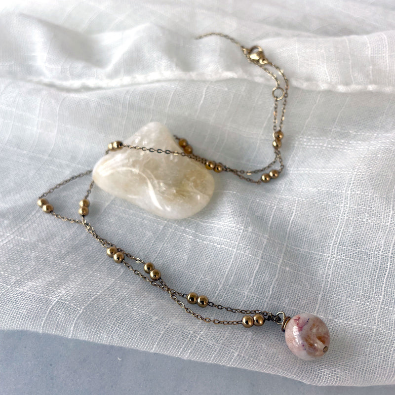 A gold plated necklace with a 10mm Citrine bead on a delicate chain with 3mm Ball and 1mm Curb Chain.